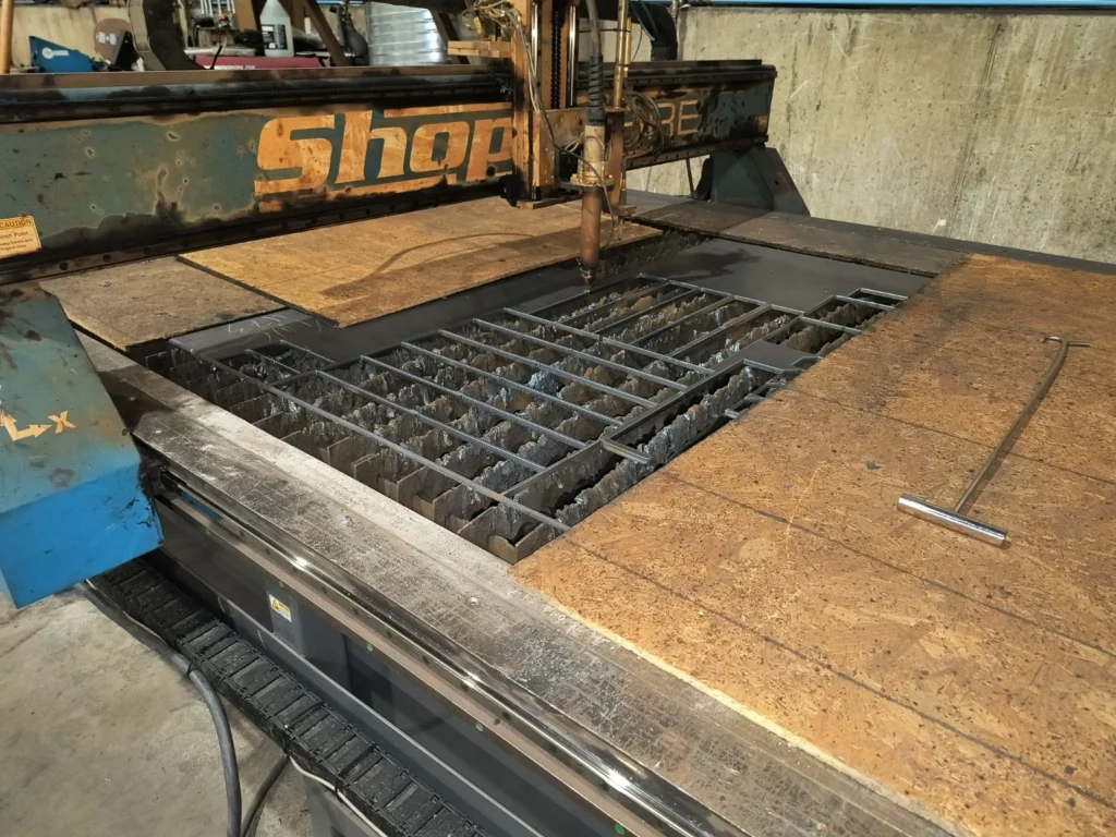 CNC plasma cutting table with nested steel profiles